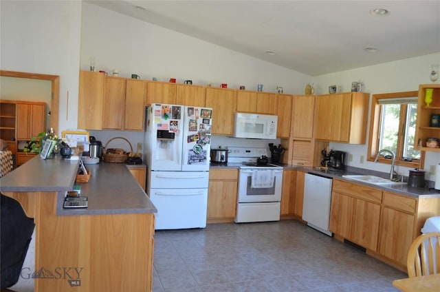5 Ginger Quill Ct, Mcallister, MT 59740 - kitchen with white appliances, a peninsula, vaulted ceiling, light tile patterned floors, and a breakfast bar