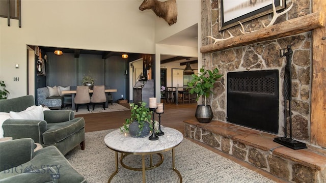 3640 Jagar Ln, Bozeman, MT 59718 - living room with a high ceiling, wood finished floors, and a stone fireplace