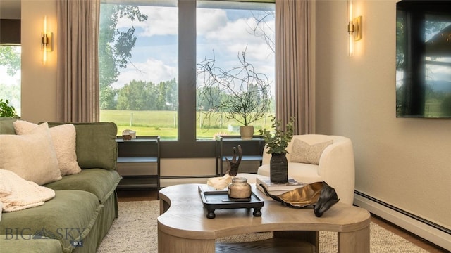 3640 Jagar Ln, Bozeman, MT 59718 - living area with a baseboard radiator, wood finished floors, and a textured wall