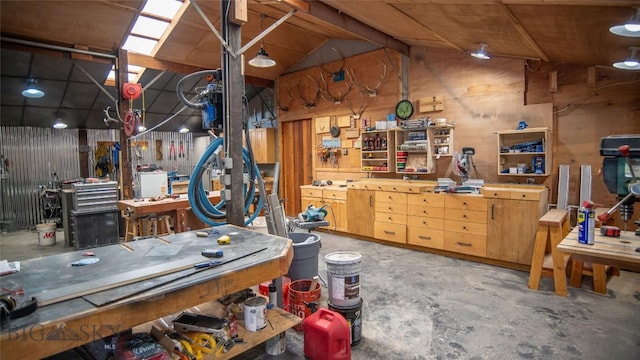3640 Jagar Ln, Bozeman, MT 59718 - misc room with a workshop area, unfinished concrete flooring, and vaulted ceiling