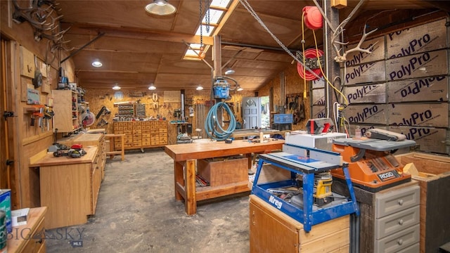 3640 Jagar Ln, Bozeman, MT 59718 - misc room featuring a workshop area and unfinished concrete flooring