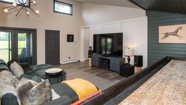 3640 Jagar Ln, Bozeman, MT 59718 - living area featuring a baseboard radiator, dark wood-style floors, high vaulted ceiling, a chandelier, and wooden walls