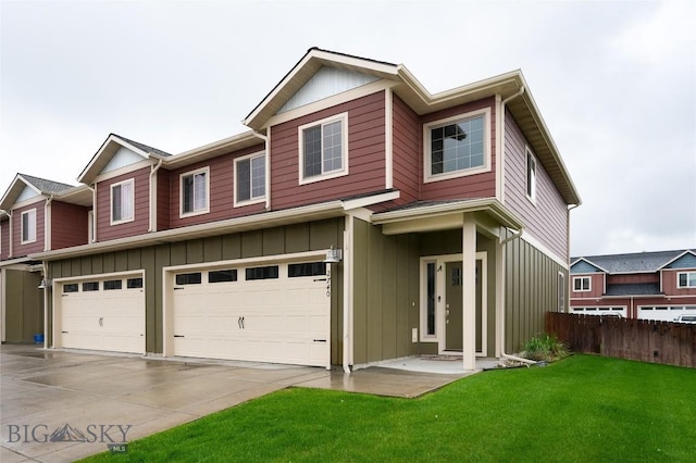 2740 Cobblestone Unit A, Bozeman, MT 59718 - view of property with board and batten siding, an attached garage, and concrete driveway