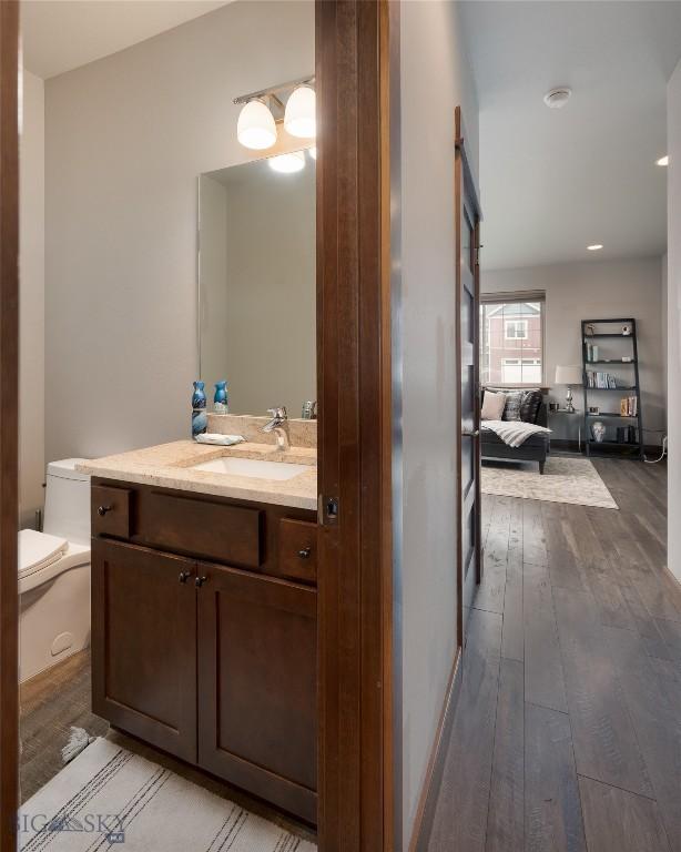2740 Cobblestone Unit A, Bozeman, MT 59718 - bathroom featuring hardwood / wood-style floors and vanity