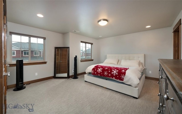 2740 Cobblestone Unit A, Bozeman, MT 59718 - bedroom with light carpet, multiple windows, and recessed lighting