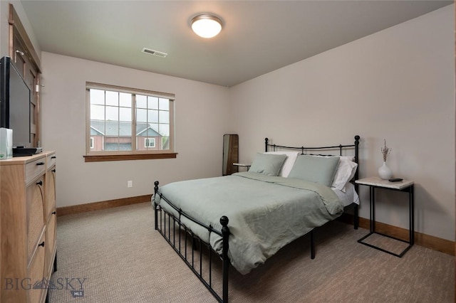 2740 Cobblestone Unit A, Bozeman, MT 59718 - bedroom with baseboards and light carpet