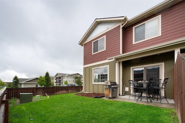 2740 Cobblestone Unit A, Bozeman, MT 59718 - rear view of property featuring a patio area and board and batten siding