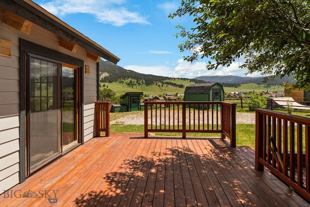 250 Silver Run Rd, Gallatin Gateway, MT 59730 - deck featuring a storage unit and a mountain view