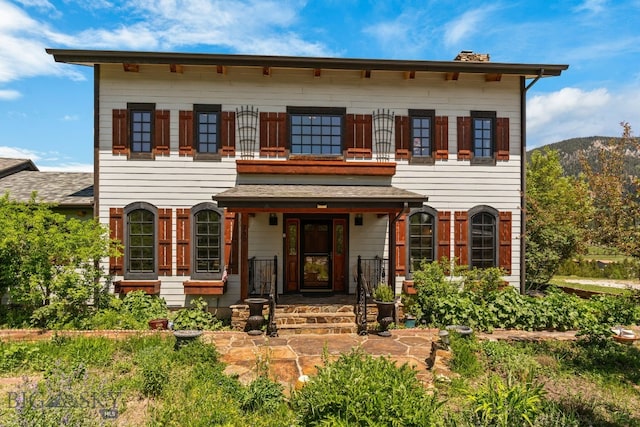 250 Silver Run Rd, Gallatin Gateway, MT 59730 - view of front of property featuring a balcony, a chimney, and a mountain view