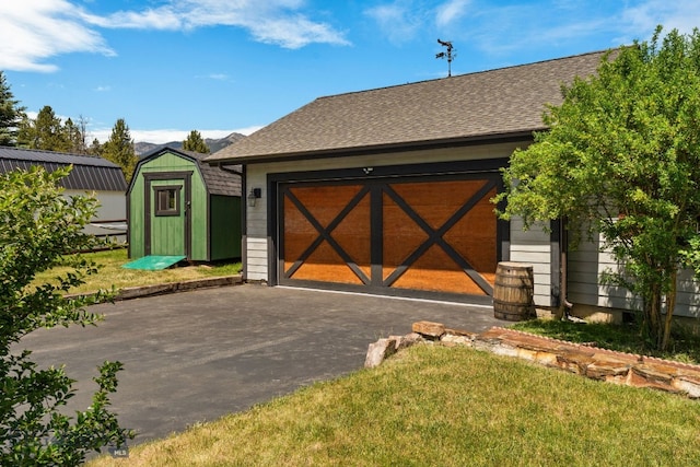 250 Silver Run Rd, Gallatin Gateway, MT 59730 - garage featuring asphalt driveway and a shed