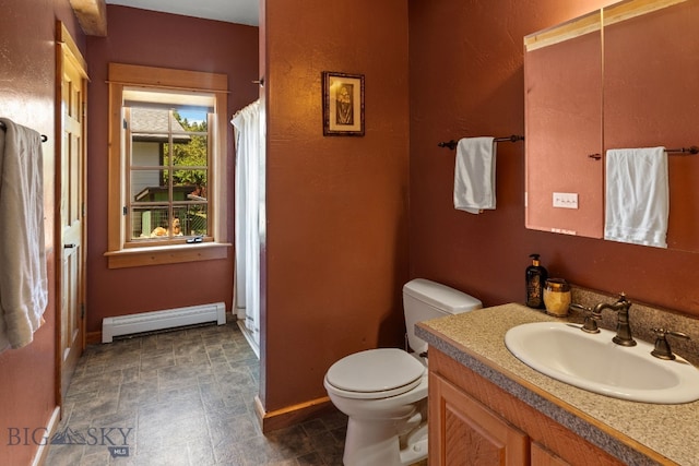 250 Silver Run Rd, Gallatin Gateway, MT 59730 - bathroom with a baseboard heating unit, vanity, a shower with shower curtain, and stone finish flooring