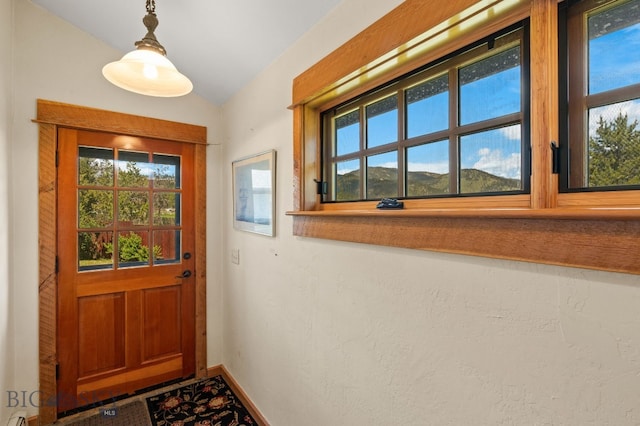 250 Silver Run Rd, Gallatin Gateway, MT 59730 - doorway with plenty of natural light and vaulted ceiling