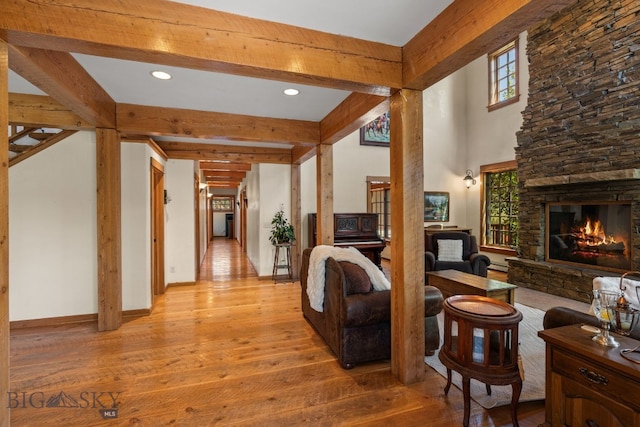 250 Silver Run Rd, Gallatin Gateway, MT 59730 - living room with light wood-style floors, beamed ceiling, a fireplace, and recessed lighting