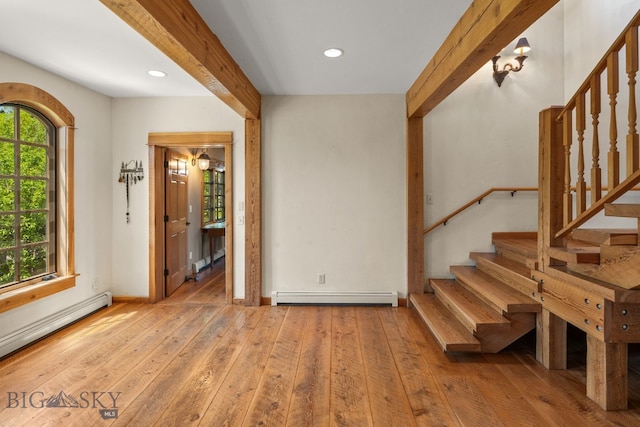 250 Silver Run Rd, Gallatin Gateway, MT 59730 - foyer featuring baseboard heating, a baseboard radiator, wood-type flooring, stairs, and recessed lighting