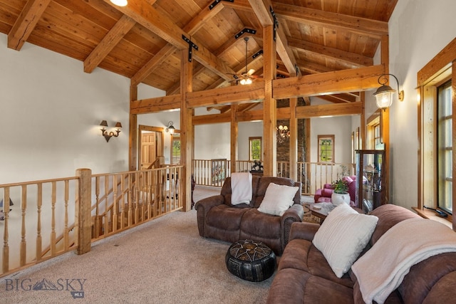 250 Silver Run Rd, Gallatin Gateway, MT 59730 - carpeted living area featuring a wooden ceiling with exposed beams, a ceiling fan, and high vaulted ceiling