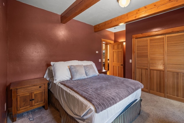 250 Silver Run Rd, Gallatin Gateway, MT 59730 - bedroom featuring carpet, beam ceiling, and a closet