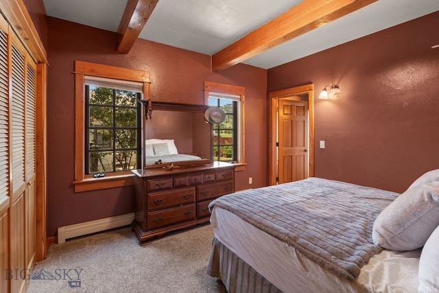 250 Silver Run Rd, Gallatin Gateway, MT 59730 - bedroom featuring a baseboard heating unit, beam ceiling, and light carpet
