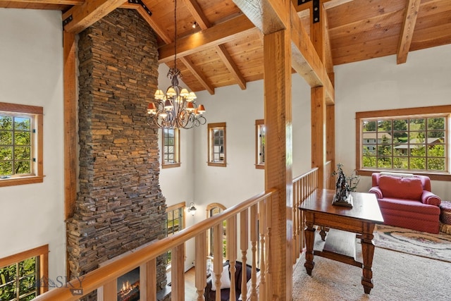 250 Silver Run Rd, Gallatin Gateway, MT 59730 - hall with high vaulted ceiling, an upstairs landing, a wooden ceiling with exposed beams, healthy amount of natural light, and a chandelier