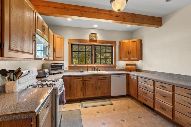 250 Silver Run Rd, Gallatin Gateway, MT 59730 - kitchen featuring white appliances, beam ceiling, recessed lighting, brown cabinetry, and dark countertops