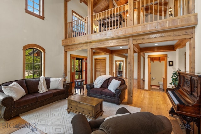 250 Silver Run Rd, Gallatin Gateway, MT 59730 - living area featuring a towering ceiling, wood finished floors, and beamed ceiling