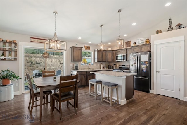 444 Highpark, Anaconda, MT 59711 - kitchen with stainless steel appliances, a kitchen island, a chandelier, decorative light fixtures, and recessed lighting