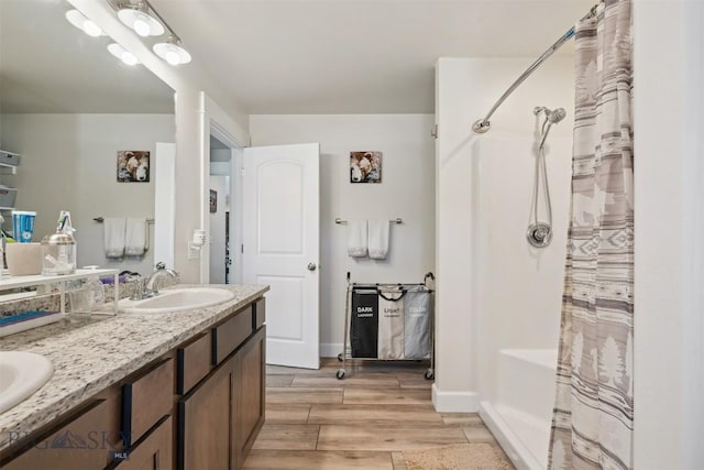 444 Highpark, Anaconda, MT 59711 - full bath featuring wood finished floors, double vanity, and shower / bath combo with shower curtain