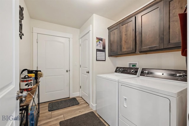 444 Highpark, Anaconda, MT 59711 - laundry area featuring separate washer and dryer, cabinet space, and light wood-style flooring