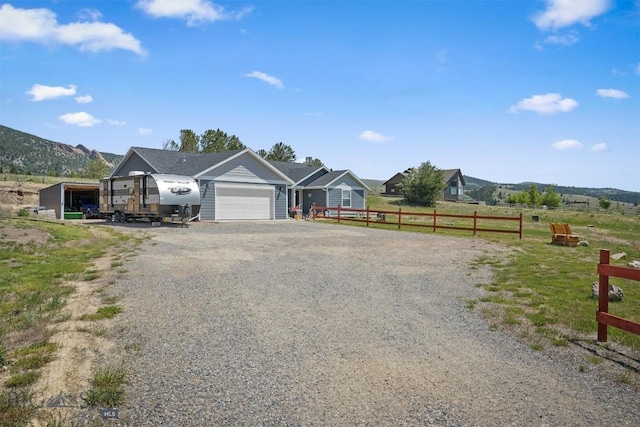 444 Highpark, Anaconda, MT 59711 - view of front of property with gravel driveway and an attached garage