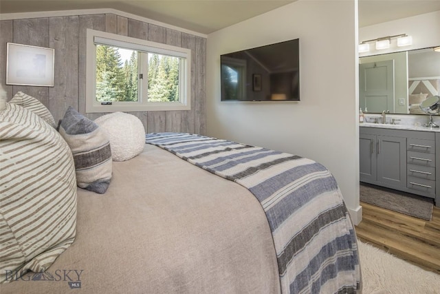 17 Chief Joseph Trl, Big Sky, MT 59716 - bedroom featuring connected bathroom and wood finished floors