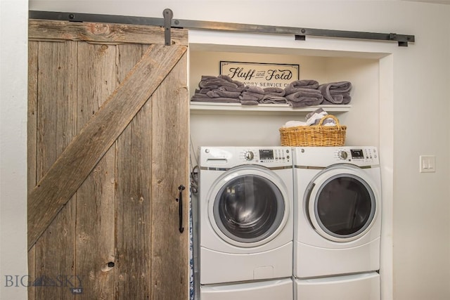 17 Chief Joseph Trl, Big Sky, MT 59716 - washroom featuring washing machine and clothes dryer and a barn door