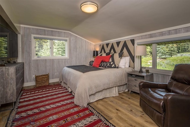 17 Chief Joseph Trl, Big Sky, MT 59716 - bedroom featuring light wood finished floors, lofted ceiling, and wooden walls