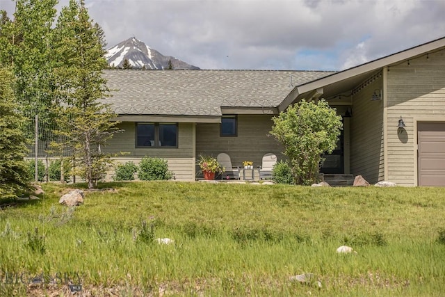 17 Chief Joseph Trl, Big Sky, MT 59716 - view of front of property featuring a front lawn and roof with shingles