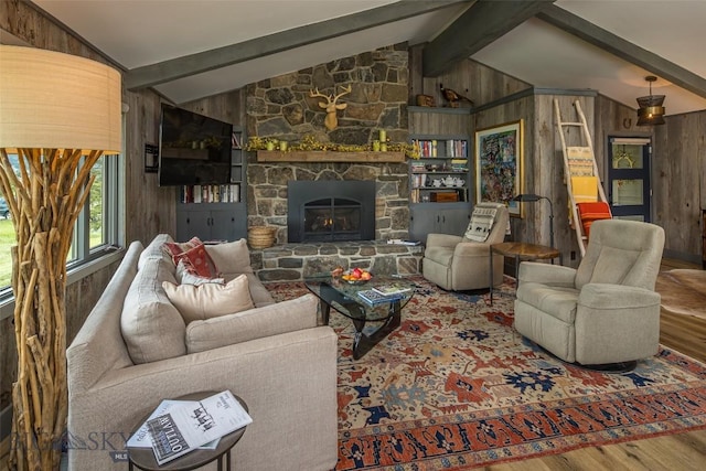17 Chief Joseph Trl, Big Sky, MT 59716 - living area featuring wood finished floors, wooden walls, and a fireplace