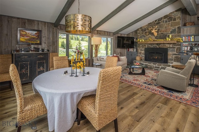 17 Chief Joseph Trl, Big Sky, MT 59716 - dining area with wood walls, wood finished floors, and a fireplace