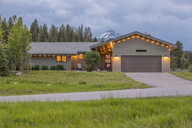 17 Chief Joseph Trl, Big Sky, MT 59716 - view of front of property featuring a garage and driveway