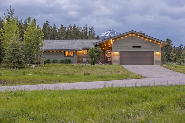 17 Chief Joseph Trl, Big Sky, MT 59716 - view of front of home with an attached garage and driveway