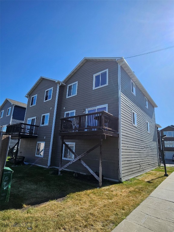 1769 W Kagy Blvd, Bozeman, MT 59715 - rear view of property with a yard and a wooden deck