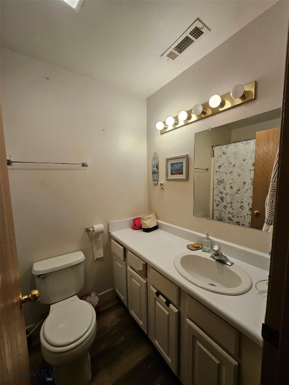 1769 W Kagy Blvd, Bozeman, MT 59715 - full bath featuring vanity, wood finished floors, and curtained shower
