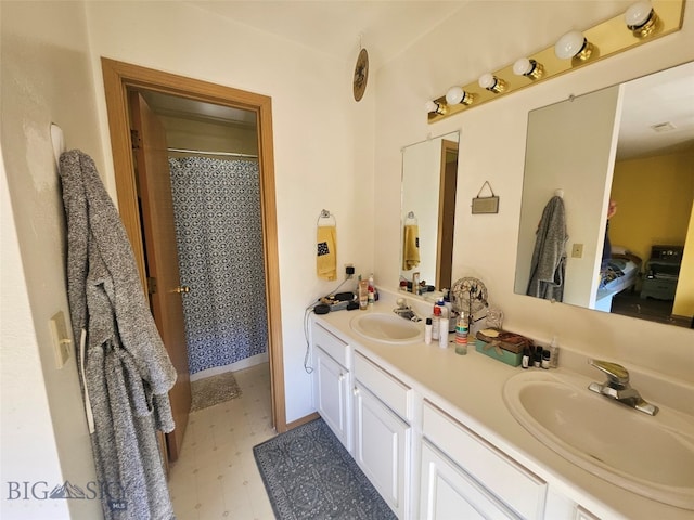 1769 W Kagy Blvd, Bozeman, MT 59715 - ensuite bathroom featuring double vanity, tile patterned floors, and curtained shower