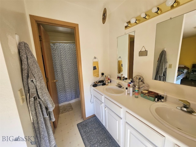 1769 W Kagy Blvd, Bozeman, MT 59715 - bathroom with double vanity, tile patterned floors, and a shower with curtain