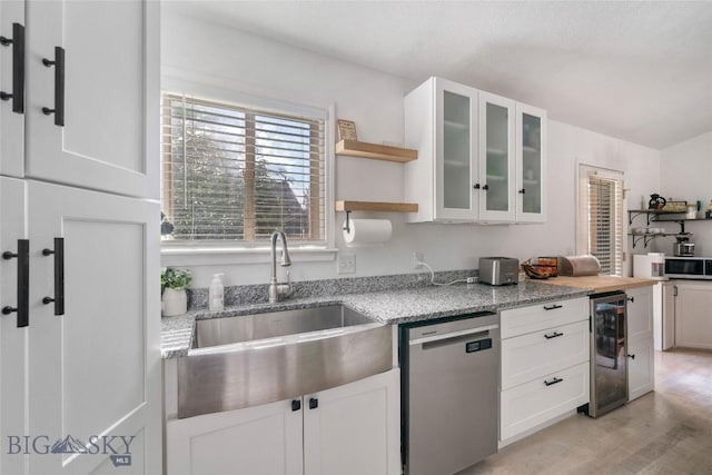 217 Lillian Way, Bozeman, MT 59718 - kitchen featuring stainless steel appliances, wine cooler, open shelves, white cabinets, and glass insert cabinets