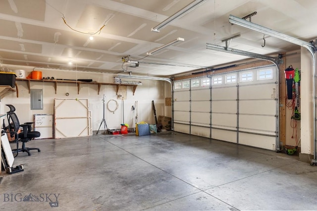 38 Red Rock, Bozeman, MT 59718 - garage featuring electric panel and a garage door opener