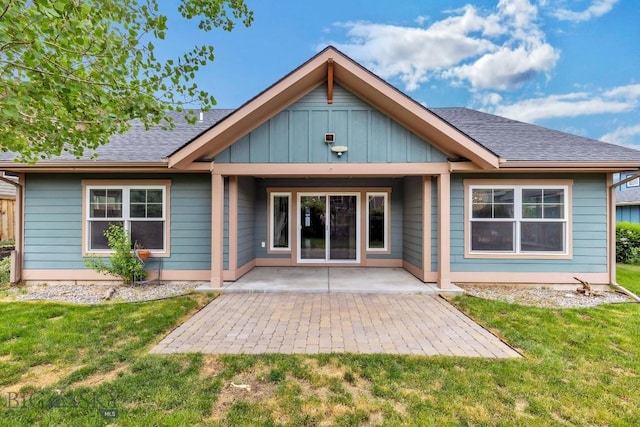 38 Red Rock, Bozeman, MT 59718 - back of property with a yard, a patio, board and batten siding, and a shingled roof