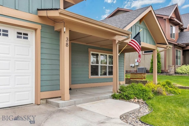38 Red Rock, Bozeman, MT 59718 - entrance to property with board and batten siding, covered porch, a shingled roof, and a lawn