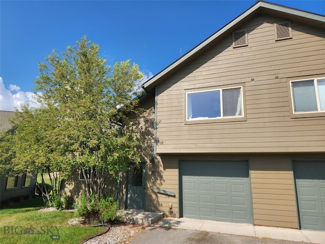 70 Candlelight Meadow Dr, Big Sky, MT 59716 - view of front facade featuring a garage
