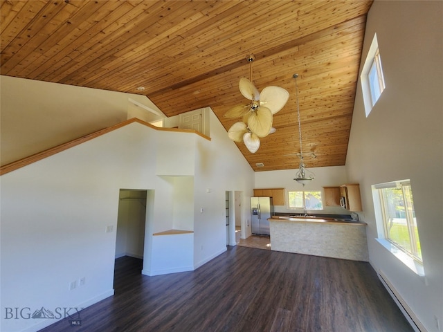 70 Candlelight Meadow Dr, Big Sky, MT 59716 - unfurnished living room featuring a baseboard radiator, high vaulted ceiling, wood ceiling, dark wood finished floors, and ceiling fan