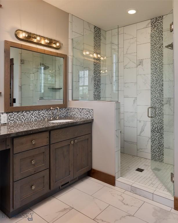 1400 Cottontail Rd, Gallatin Gateway, MT 59730 - full bathroom with marble finish floors, a stall shower, vanity, and recessed lighting