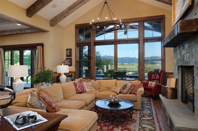 1400 Cottontail Rd, Gallatin Gateway, MT 59730 - living area featuring a mountain view, beamed ceiling, a chandelier, a fireplace, and wood finished floors