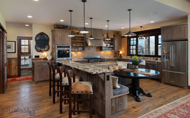 1400 Cottontail Rd, Gallatin Gateway, MT 59730 - kitchen with appliances with stainless steel finishes, open shelves, island exhaust hood, dark wood-style flooring, and recessed lighting