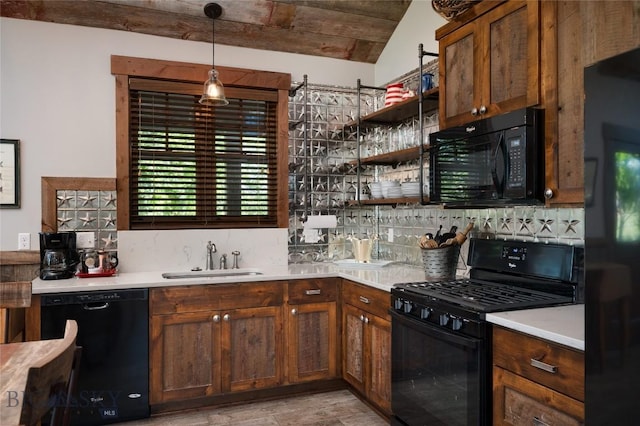 1400 Cottontail Rd, Gallatin Gateway, MT 59730 - kitchen with black appliances, tasteful backsplash, and light countertops